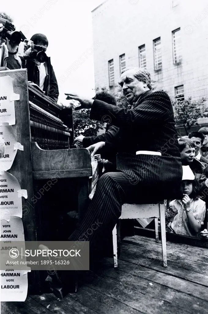 Denis Healey (b 1917) canvassing votes for the Labour Party by playing the piano at Huddersfield Town Hall. Healey was secretary of state for defence ...