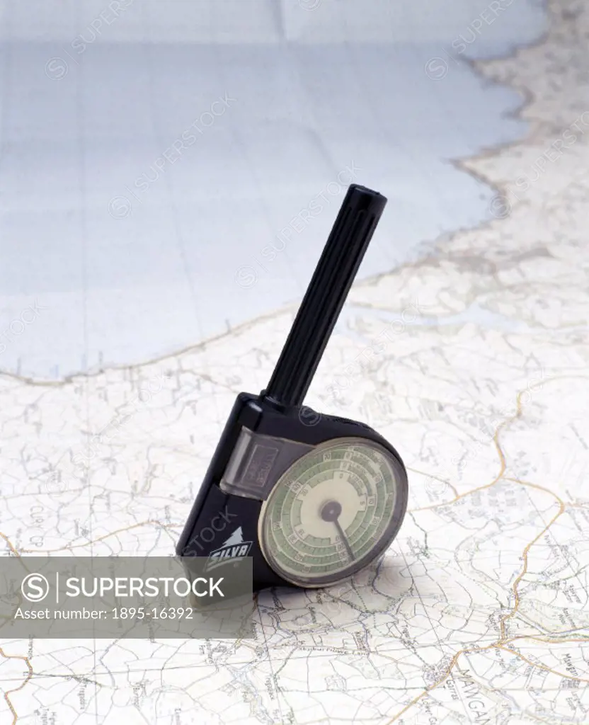 A map measurer for motorists and hikers, which has a black plastic casing with two dials, a magnifying glass and a zeroing revolution counter. Made in...