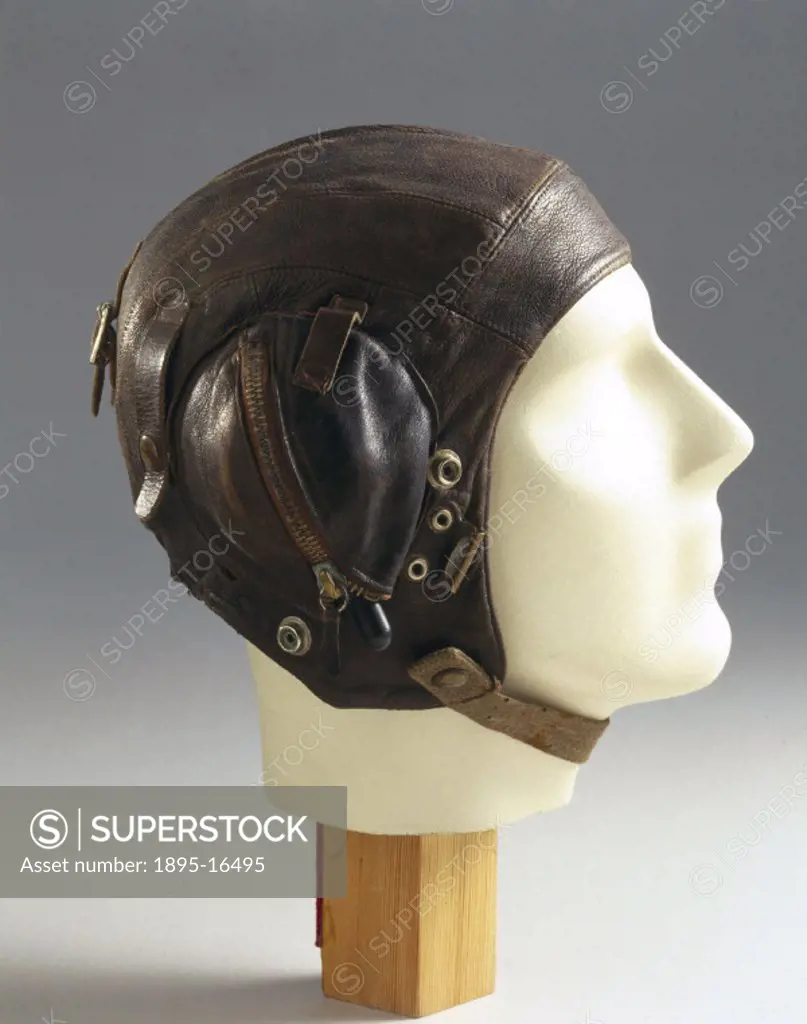 Leather flying helmet with zipped ear pockets and fittings for an oxygen mask. At the outbreak of WWII (1939-1945), flying helmets had changed little ...
