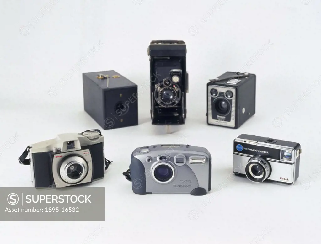 This selection, showing the changing design of Kodak cameras, includes George Eastman´s (1854-1932) original 1888 Kodak camera (back left), folding ca...