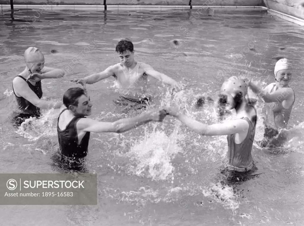 People splashing in a pool, Chiswick open air baths, London, 13 May 1931.