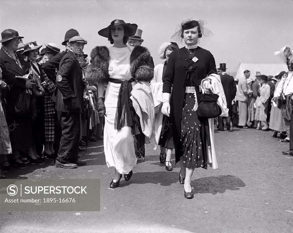 Fashions at the Royal Ascot Races, Berkshire, Gold Cup Day, 18 June 1936. Female racegoers promenading in front of the public on Ladies Day. They are...