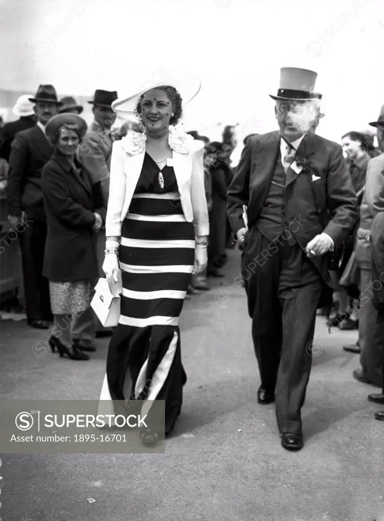 Fashions at the Royal Ascot Races, Berkshire, 15 June 1938.Mrs William Connell promenading in a striking black and white outfit, on the second day of ...