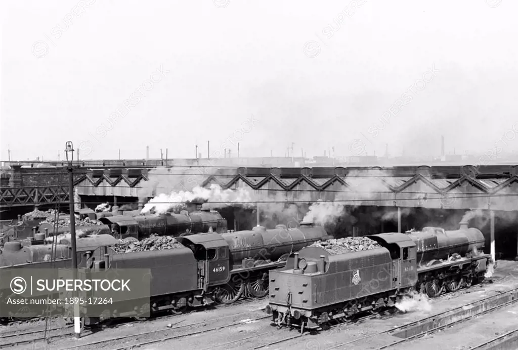 Outside the shed are the Jubilee Class 4-6-0 steam locomotive No 45681, ´Aboukir´, Royal Scot Class 4-6-0 No 46159, ´Royal Air Force´ and in the backg...