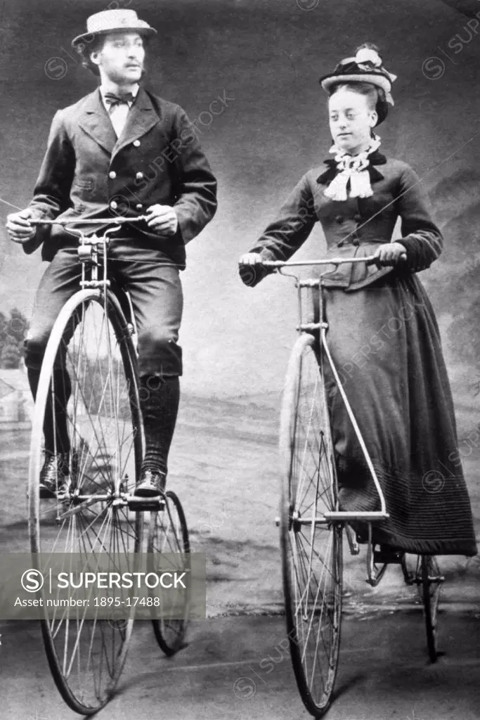 A man and a woman riding bicycles; the woman is riding side-saddle, in keeping with the convention of the time. Although the ´ordinary´ bicycle (commo...