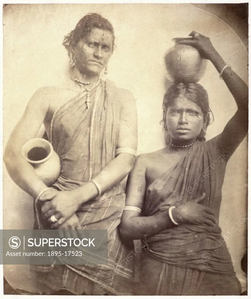 Three quarter length portrait of two women from Ceylon (now Sri Lanka) holding pots by Julia Margaret Cameron (1815-1879). Cameron´s photographic port...