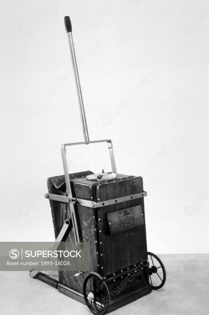Print showing a BVC (British Vacuum Cleaner) hand-operated vacuum cleaner with one tube and suction  nozzle. The British Vacuum Cleaner Company was fo...