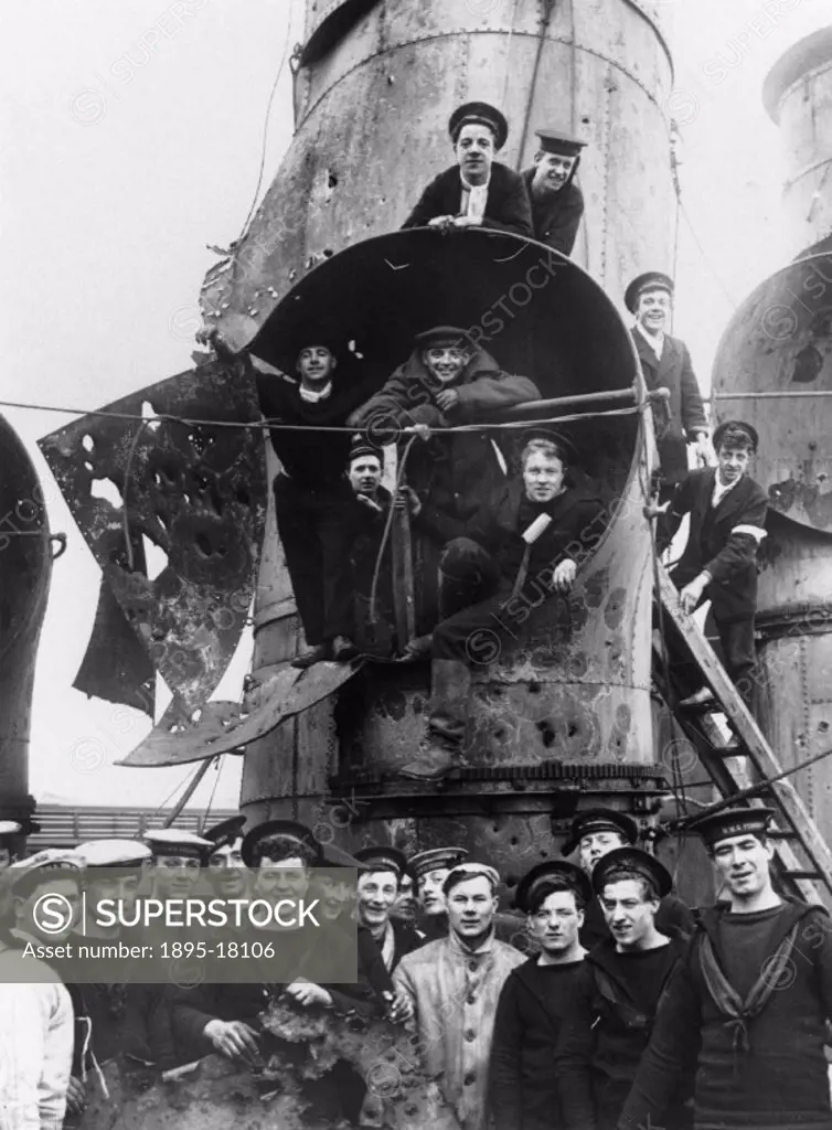 Some of the crew of the British cruiser ´Vindictive´ gathered round the shattered funnels of the vessel, Zeebrugge Raid, 1918. Britain believed that G...