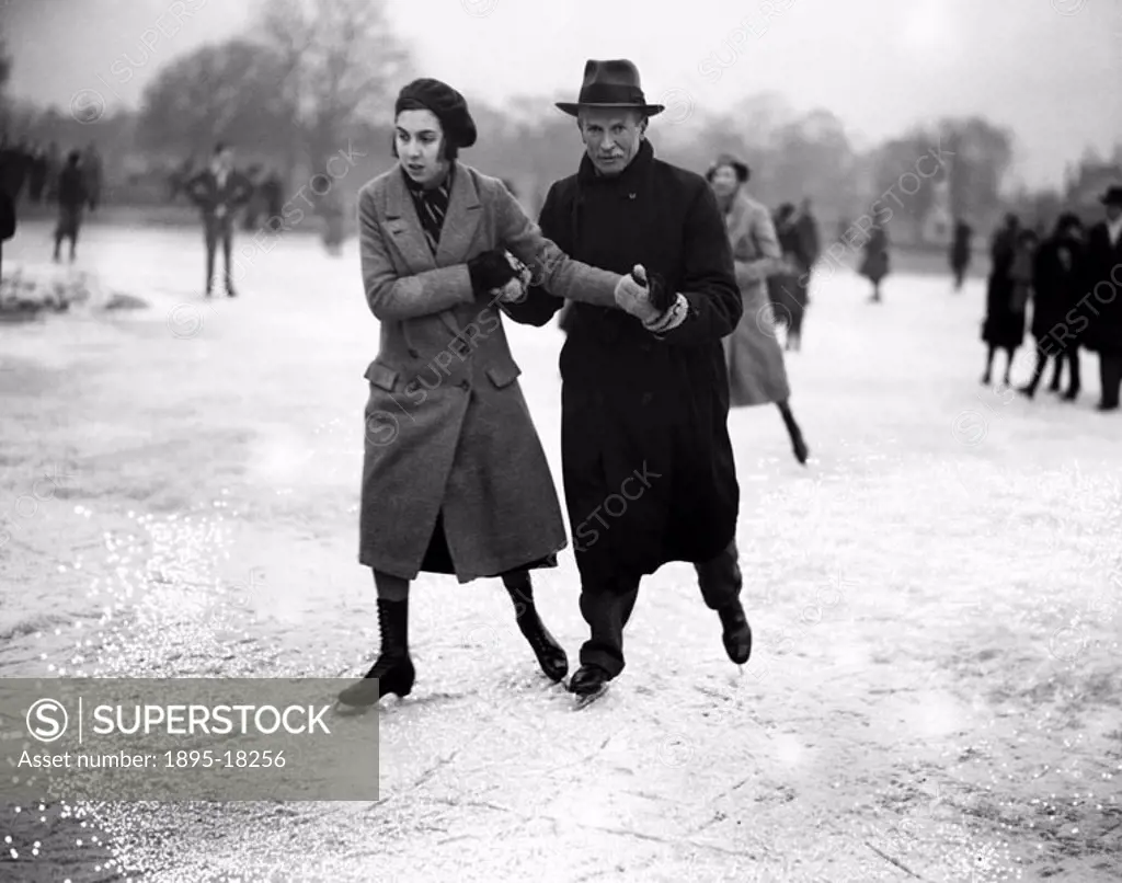 A couple ice skating, Wimbledon, London, 27 January 1932.