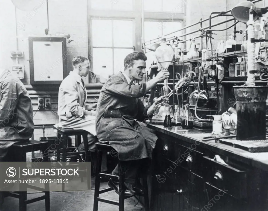 Scientists using their apparatus for experiments in the chemical section laboratories. Photograph by Harold Tomlin.