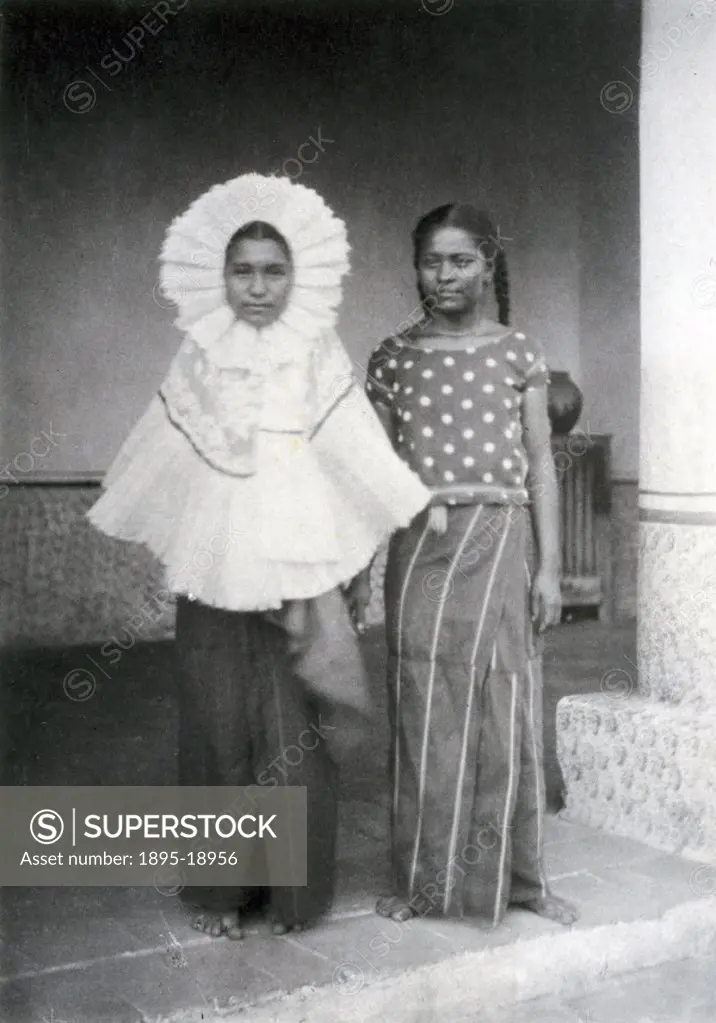 Two Mexican women in traditional costume from Tehuantepec in the south. The woman on the left is wearing a lace ruff round her face, and the one on th...