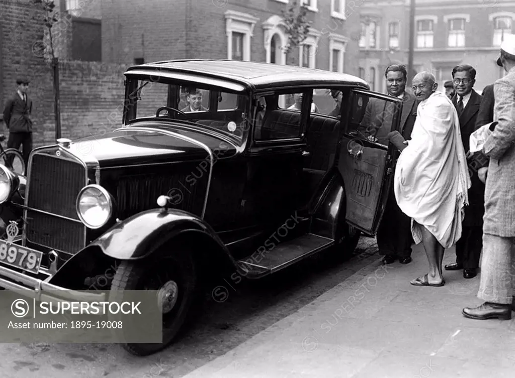 Gandhi entering a car outside Kingsley Hall  Gandhi 1869-1948 is remembered for his civil disobedience policy against British rule in India and his be...