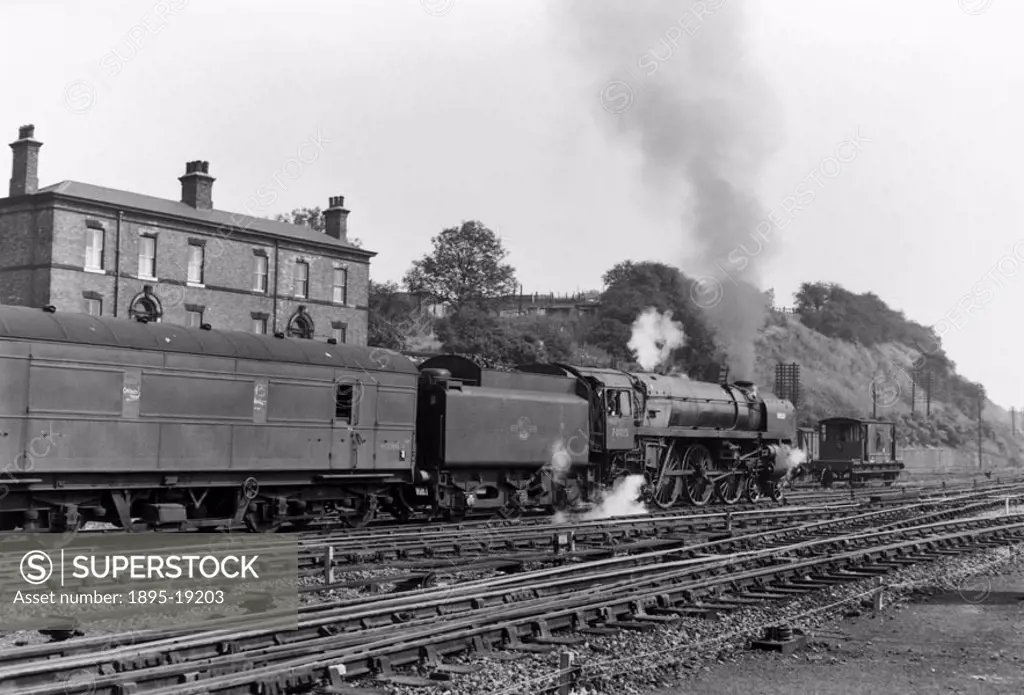 British Railways Standard Class 7P6F 4-6-2 steam locomotive, No 70015 ´Apollo´, with goods train leaving Wakefield Kirkgate. Photograph by Bishop Eric...