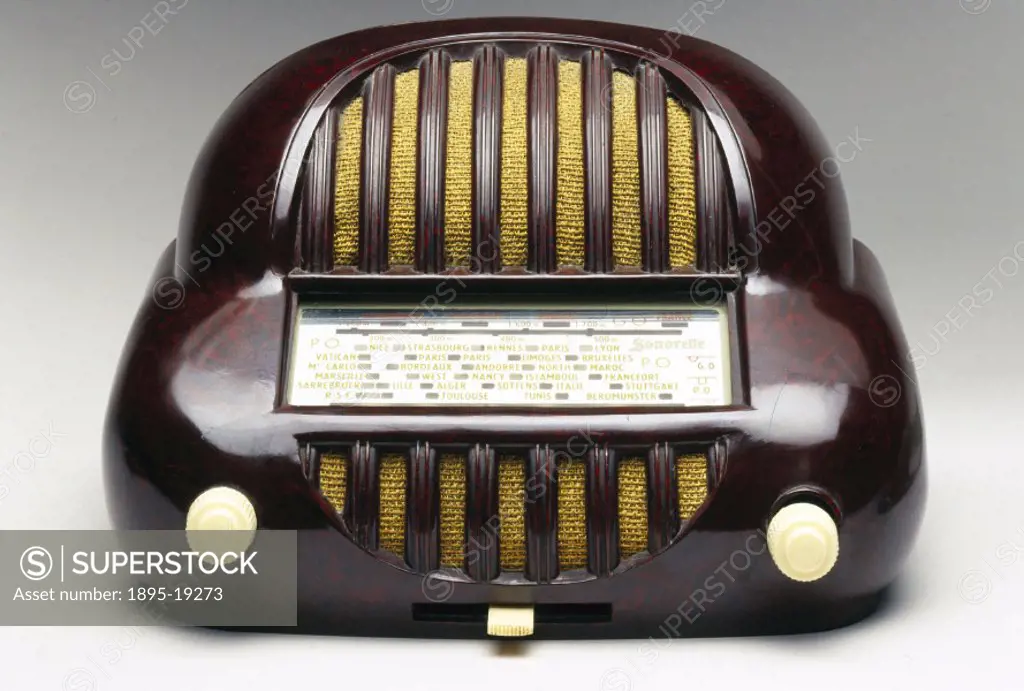 Sonorette walnut bakelite radio, French, late 1940s.This radio has ivory phenolic plastic knobs, and a silver face with red, yellow and white letterin...