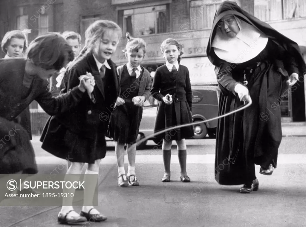 ´On a pavement outside a busy London street, a nun teaches her pupils to skip. Theirs is a school without a playground, a school where, until a few da...