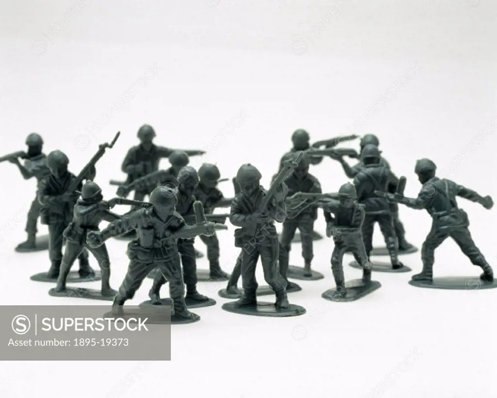 Group of plastic soldiers with guns.