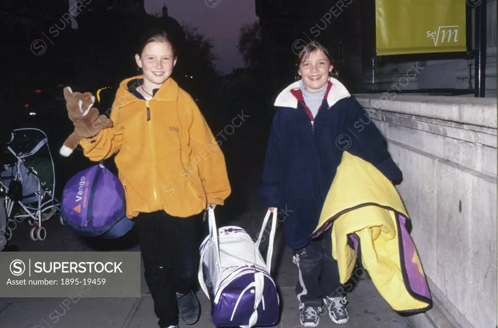 Children arriving at Science Night at the Science Museum, London, 17 November 2000.