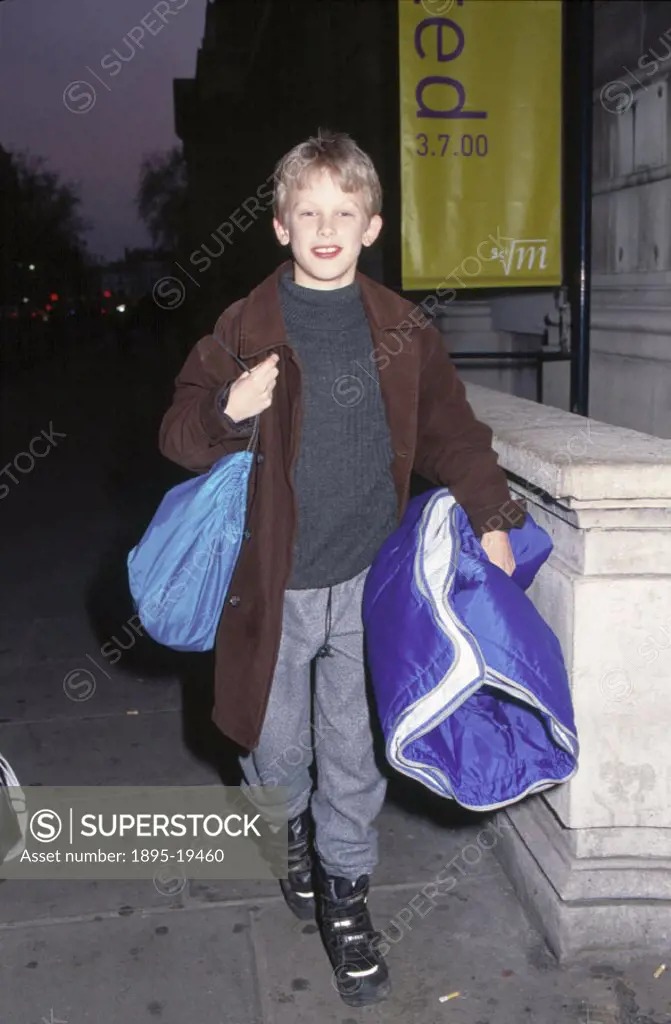 A child arriving at Science Night at the Science Museum, London, 17 November 2000.