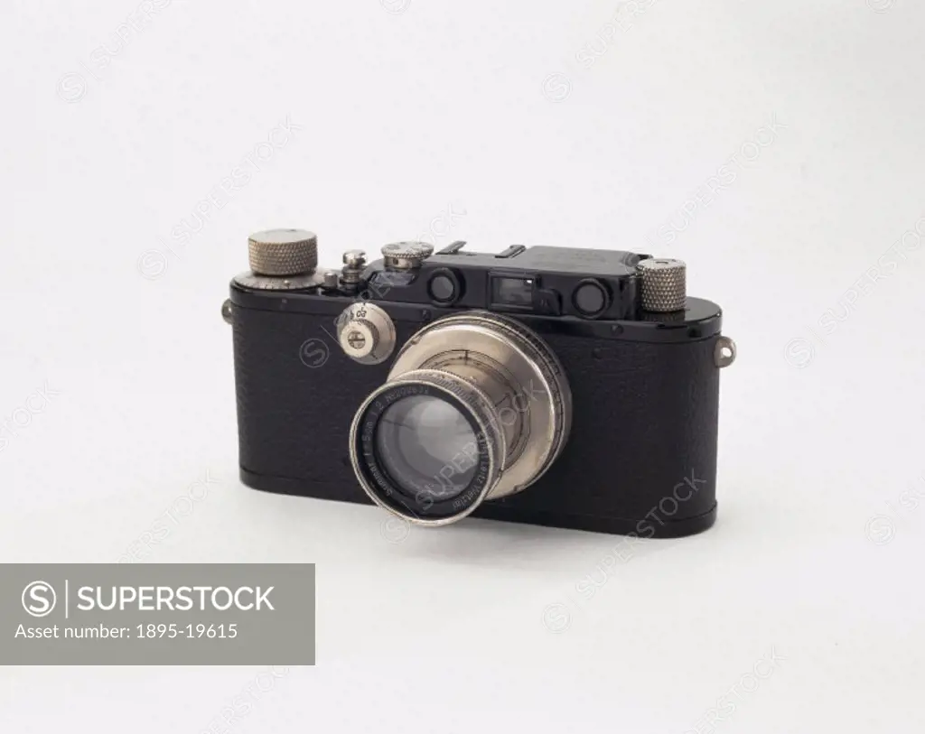 A black-enamelled Leica III with a screw mount for interchangeable lenses and a built-in coupled rangefinder with a magnifying eye-lens (1.5x). This w...