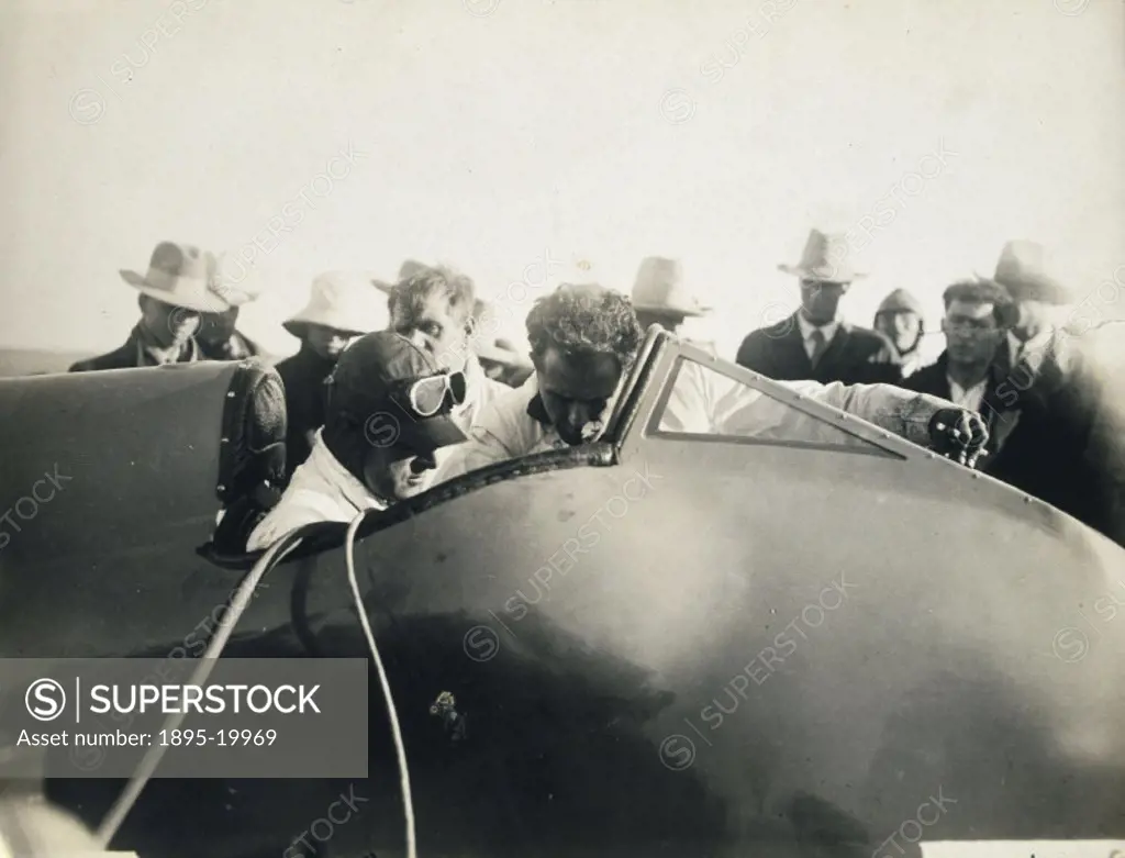 Photograph showing Campbell (1885-1949) sitting in his racing car the ´Bluebird´ at the South African Dustpan preparing to break a speed record. Campb...