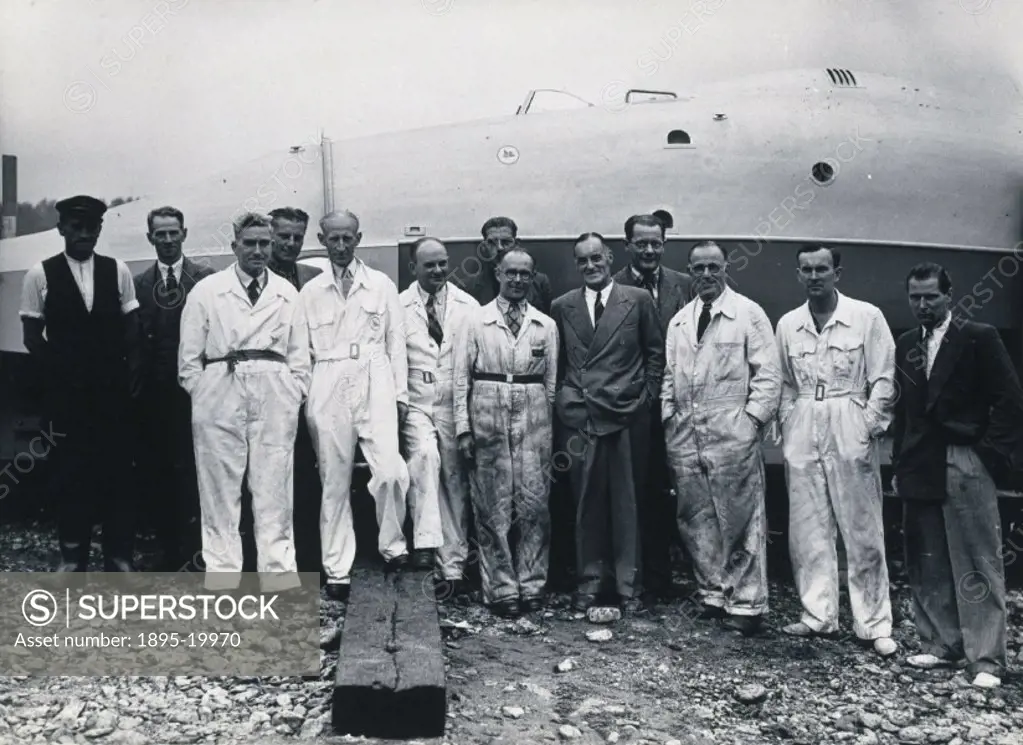 The last photograph taken of Campbell (1885-1949) before his death. Campbell (in suit, centre right) and his team are posing alongside the first jet p...