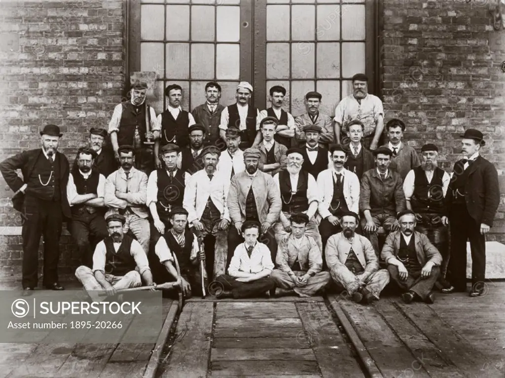 Photograph of fitters, boilermakers and young apprentices at the Midland Railway´s Wellingborough depot. Regular repair and maintenance work was under...