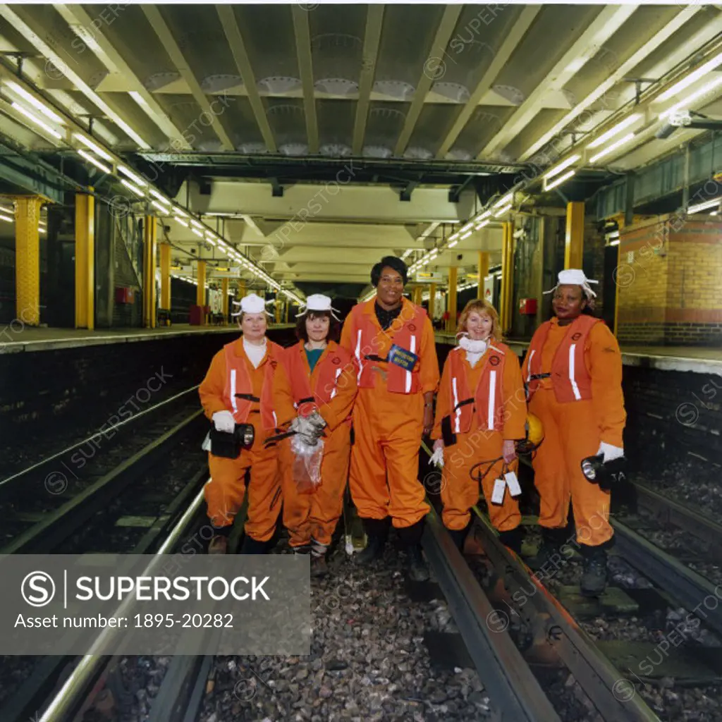 A team of ´fluffers´ working at Whitechapel Station on the District Line, London, November 1994. Although London Transport had a tunnel cleaning train...