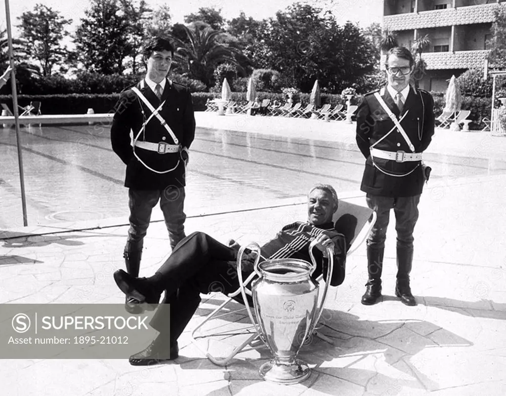 Fagan reclining in a deckchair by the pool  Fagan was manager of Liverpool FC during the 1980s, and is shown here with the European Cup, following his...