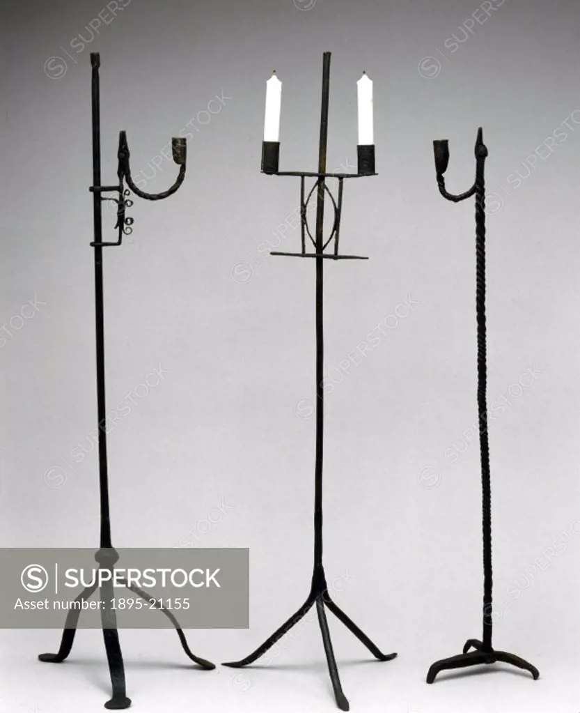 Three floor-standing rushlight or candle holders made of iron, probably dating from the 18th century.