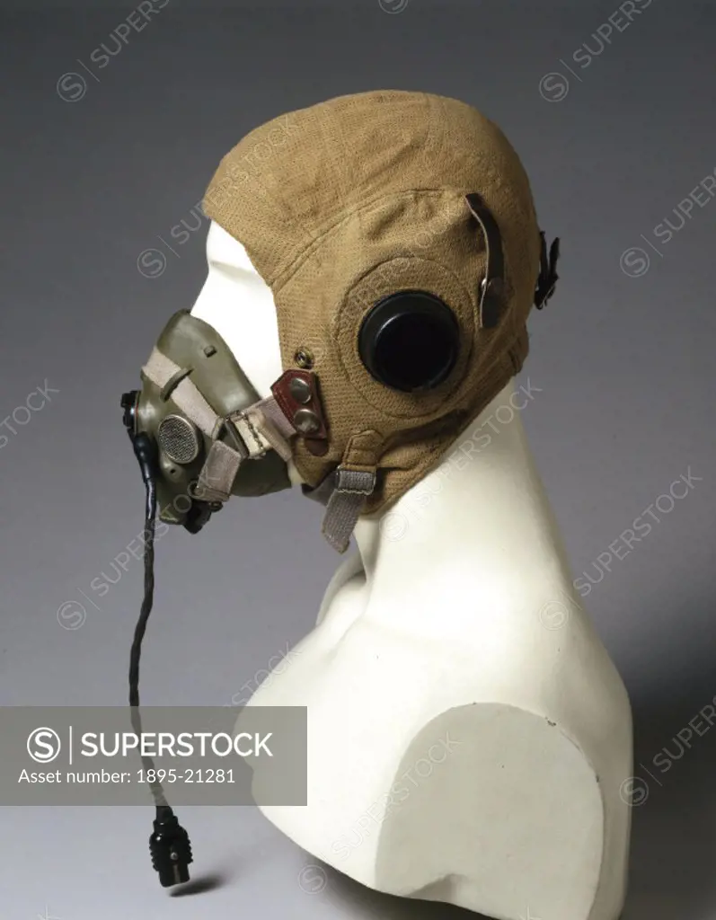 Aertex fabric flying helmet type 22C/747 incorporating electric headphones and oxygen mask, made for the Air Ministry. At the outbreak of WWII (1939-1...