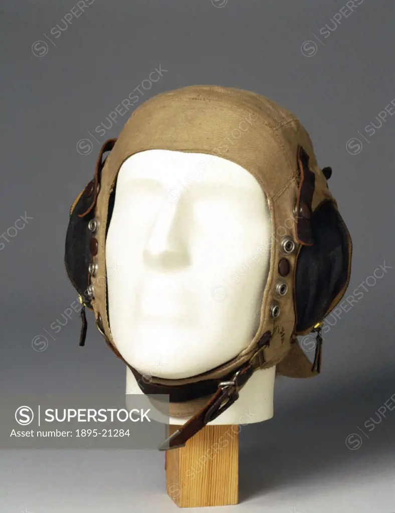 Silk-lined fabric flying helmet with neck flap and zipped ear pockets, made for the Air Ministry. At the outbreak of WWII (1939-1945), flying helmets ...