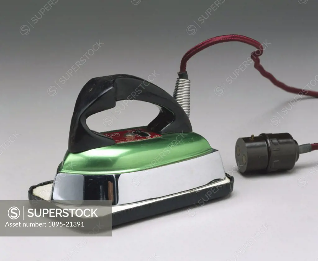 Electric travelling iron, patent number 604081, with variable voltage, flex and light socket adaptor, made by AB Metal Products Ltd, London, and iron ...