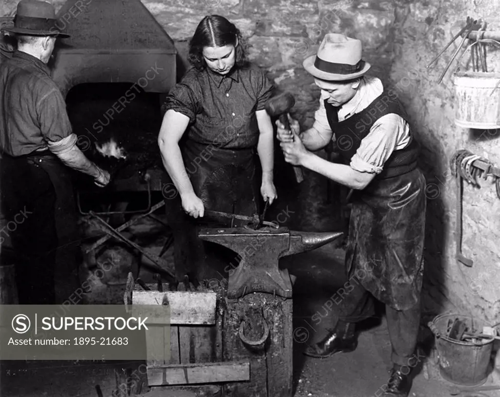 Blacksmiths at work, New York City, c 1910s One of a series of photographs of women and men at work, taken by Lewis Wickes Hine 1874-1940  Trained as ...