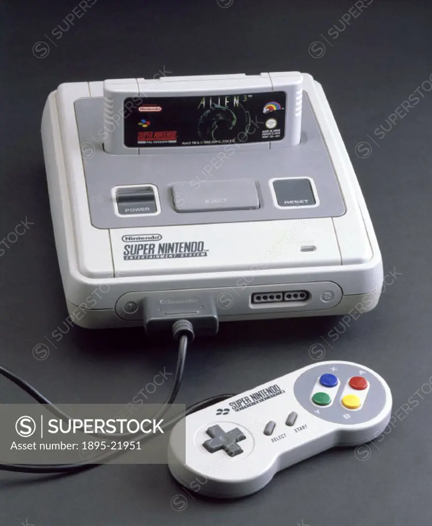 Super Nintendo Entertainment System, 1992. Computer games console with ´Alien 3´ game cartridge and one hand-held controller made by Nintendo, Japan.