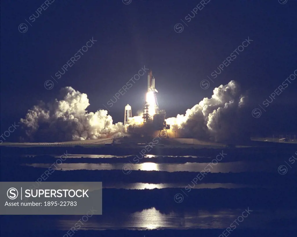The Space Shuttle Atlantis’ blazes through the night sky to begin the STS-86 mission, stated to be the seventh of nine planned dockings of the Space ...