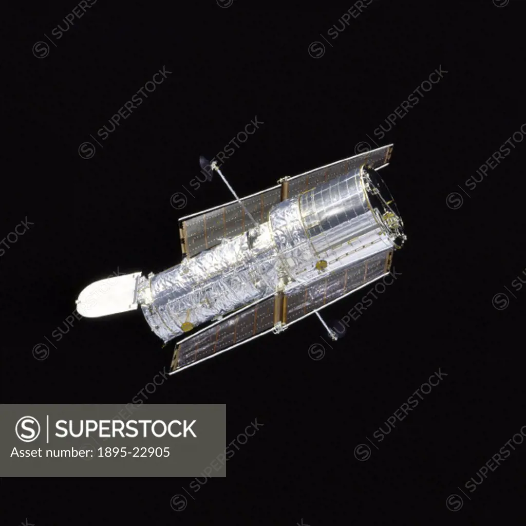 Orbiter Discovery performs a flyaround of the Hubble Space Telescope (HST) after redeployment on the second servicing mission designated HST SM-02. Th...