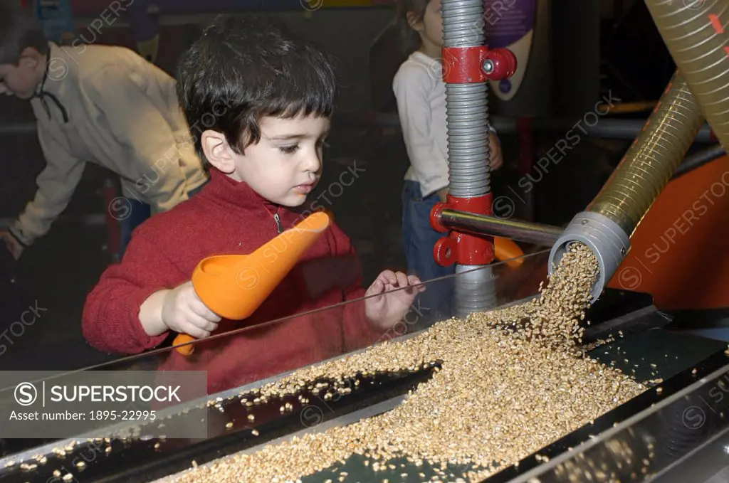 The Grain Pit is an interactive exhibit in the Launch Pad gallery at the Science Museum, London. By turning handles on the exhibit, grain is moved in ...