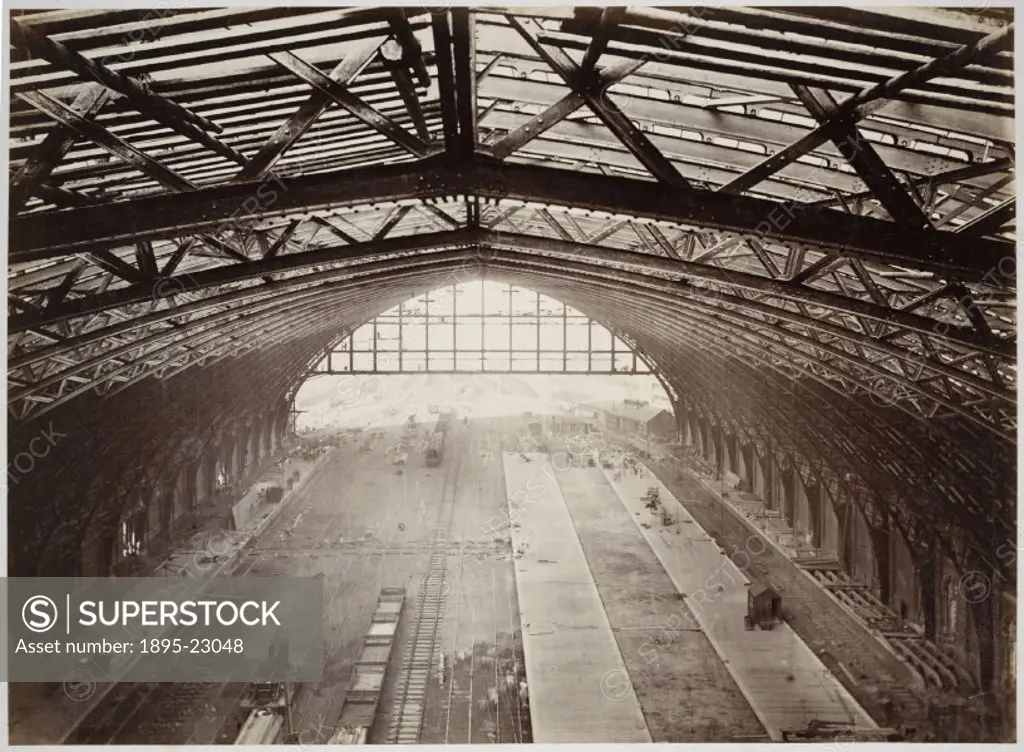 Photograph of the roof and platforms of St Pancras station, seen as construction neared completion in 1868. The station was built as a terminus for th...