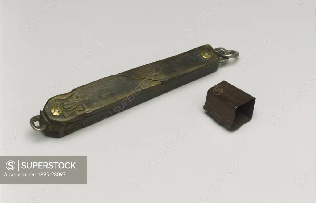 Wooden case containing 2 needles and 4 lancets, all metal. The instruments would have been used for blood letting and suturing (stitching) wounds. In ...