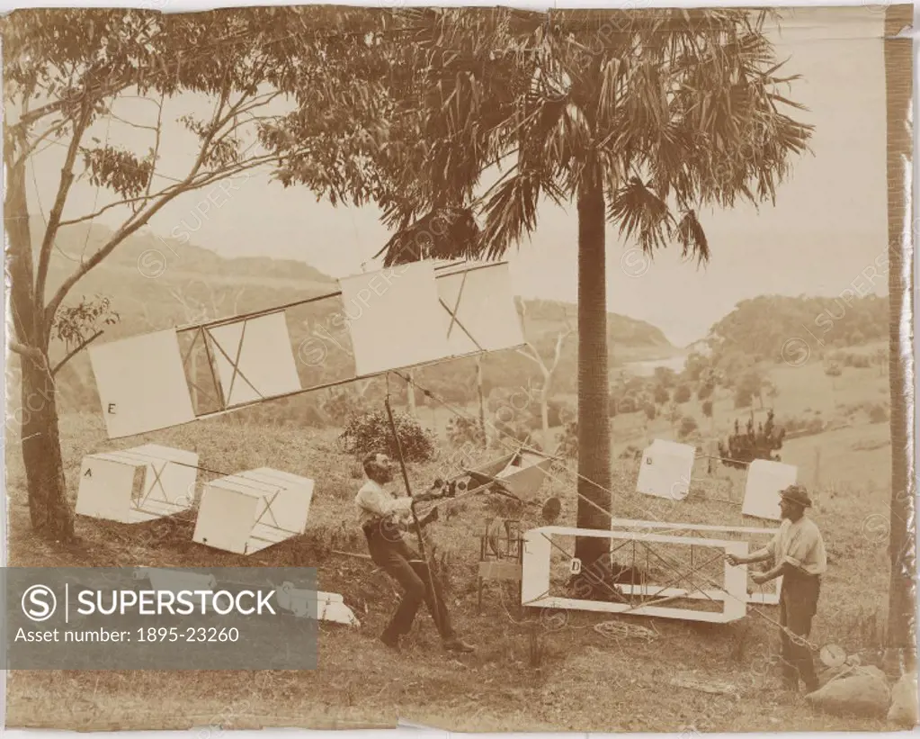 Photograph showing two men with box kites of the type designed by Lawrence Hargrave (1850-1915), the English-born Australian aeronautical pioneer. Har...