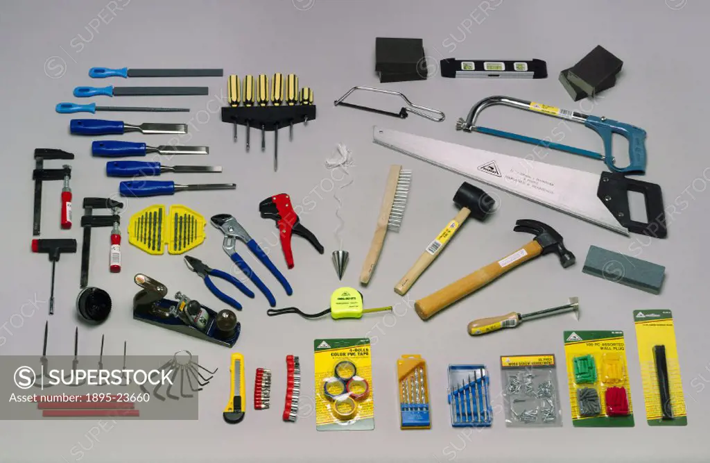 These tools, which include a spirit level, saws, hammers, pliers, gauges, clamps, and assorted screws and keys, are part of a 114-piece general purpos...