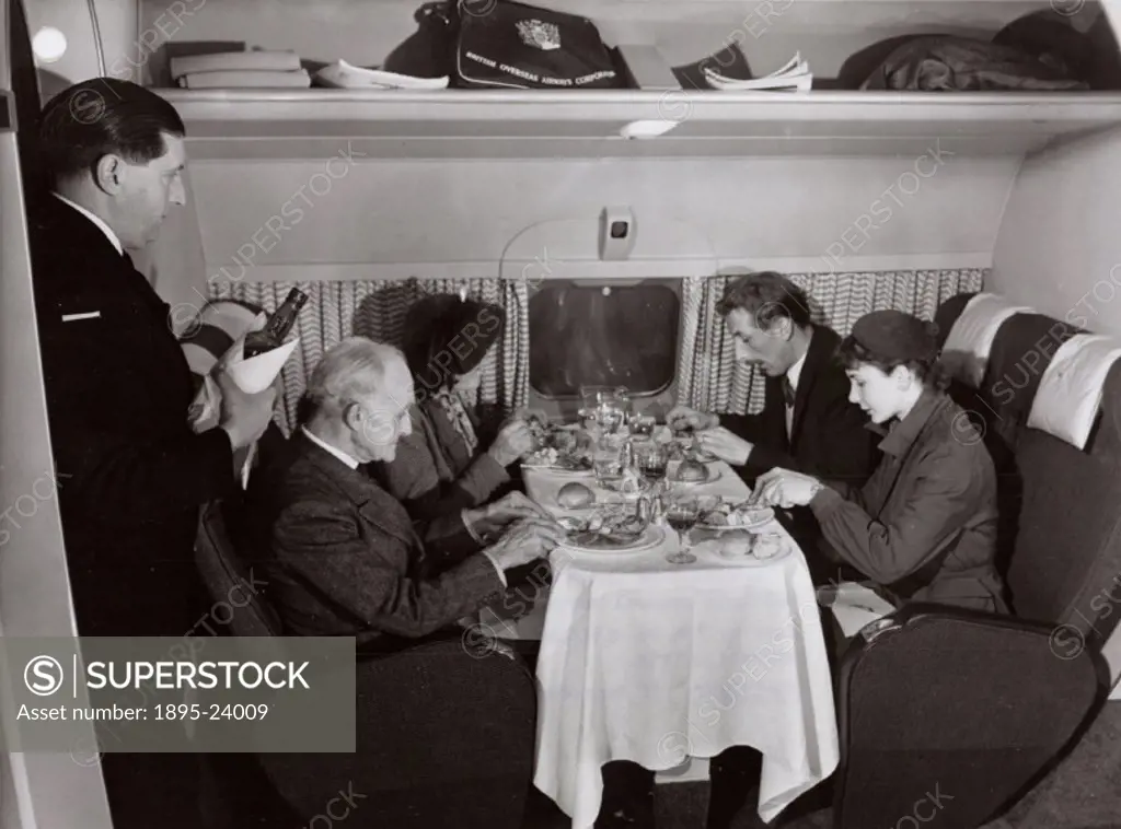 Passengers enjoy premium service during their flight in a Comet 1. The De Havilland Comet 1 was the first commercial jet airliner when it entered serv...