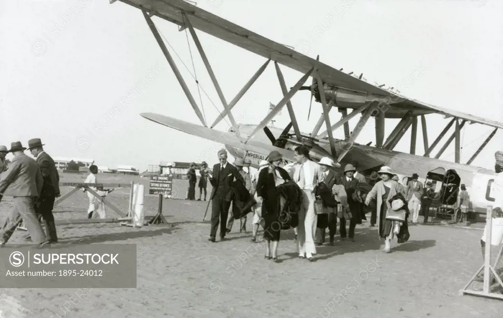 Disembarking passengers at Khartoum in Anglo-Egyption Sudan on the Alexandria-Karachi sector. The Handley Page HP42 was the most famous Imperial Airwa...
