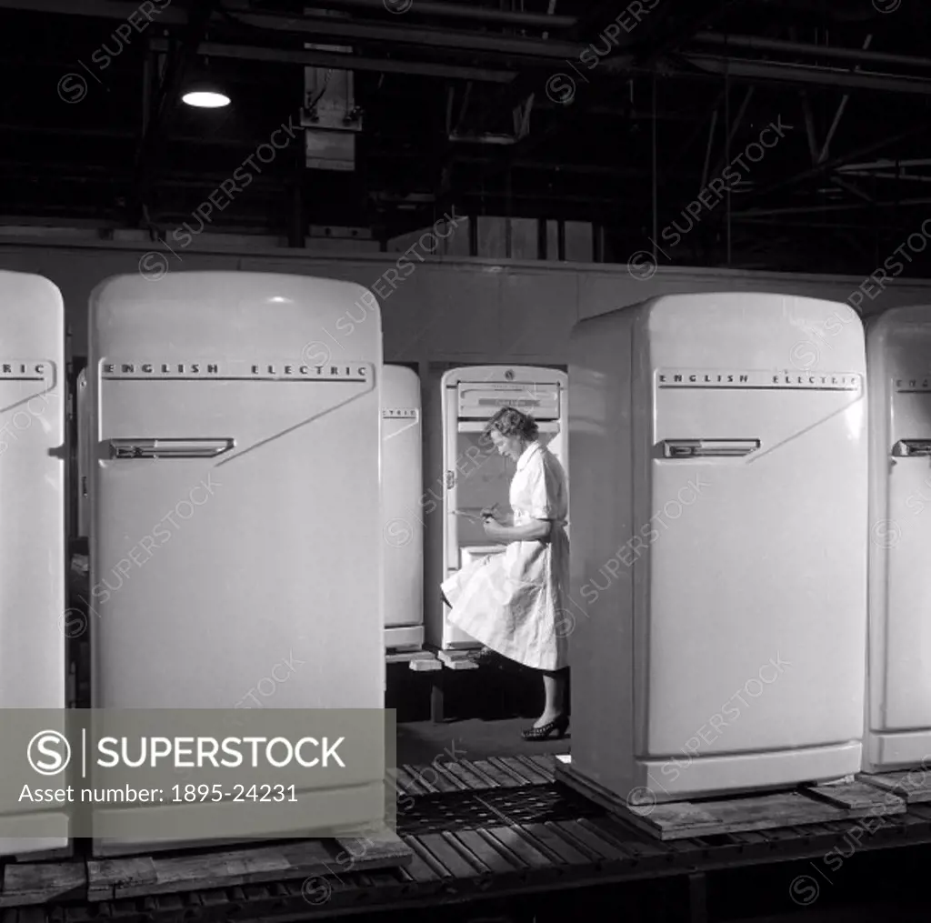 At the English Electric domestic plant, a line of refrigerators are examined before despatch. Photograph by Walter Nurnberg who transformed industrial...