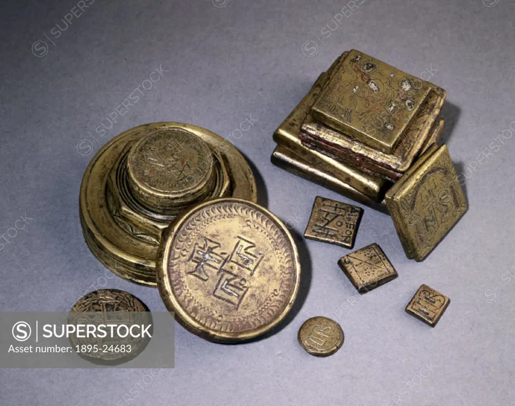 A selection of flat, circular and square Byzantine Uncia bronze weights, inscribed with Roman figures and numerals.