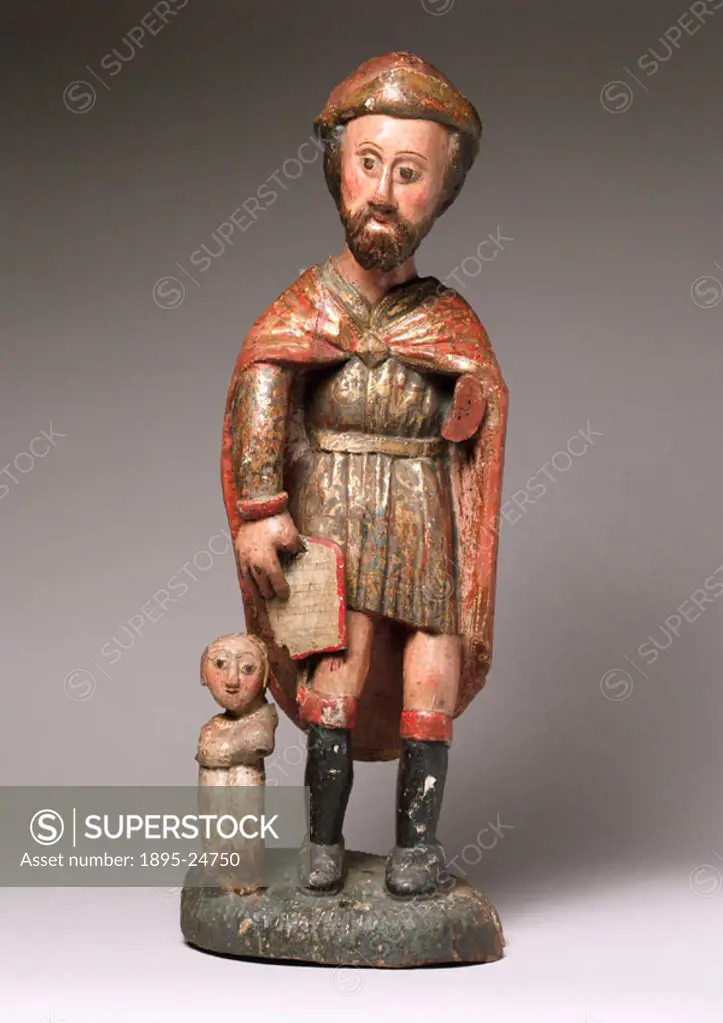 Wooden statue of St Roch, or St Rocco, associated with the sick. The pustule on the statues leg identifies it as St Roch who caught the plague and wa...