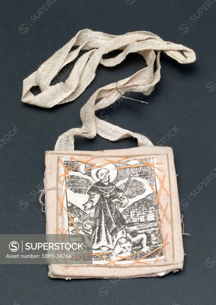 Cloth amulet to be worn around the neck, to protect against toothache, snake bites and rabies. The picture sewn to front shows a saint, possibly St Do...