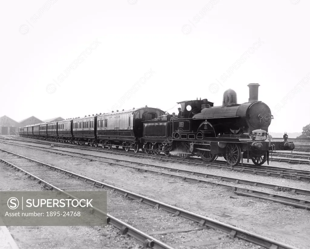 A ´Teutonic´ class 2-4-0 locomotive number 1304 Jeanie Deans’ with a passenger train at Wolverton works, Buckinghamshire. This LNWR (London & North W...