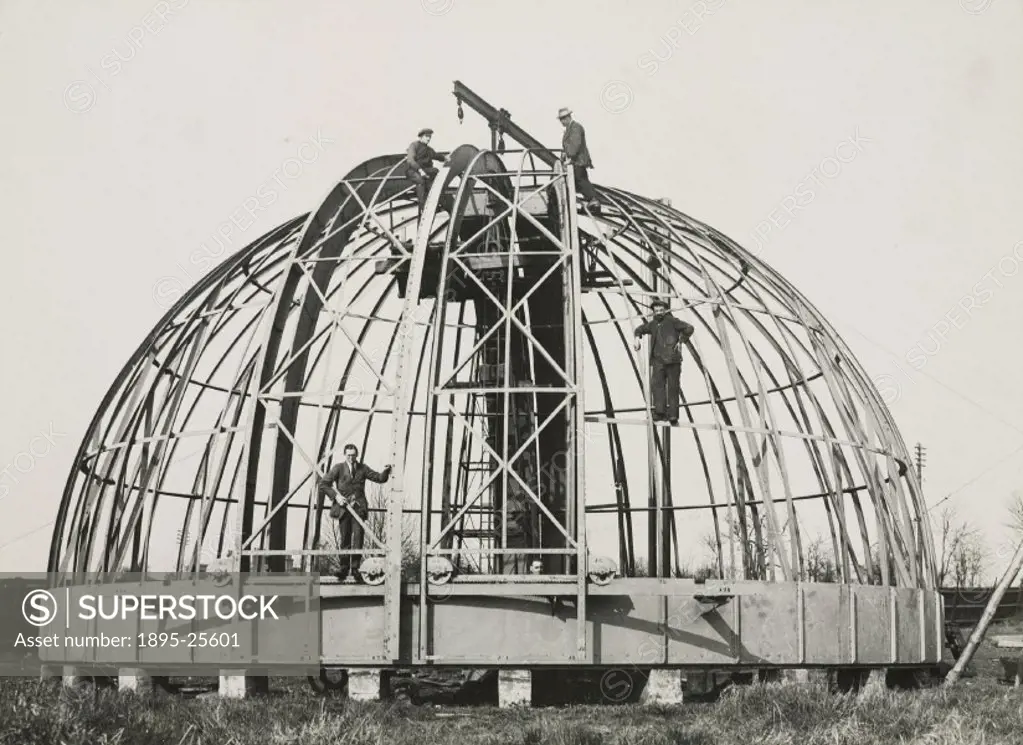 Photograph showing a partly assembled dome being built by the company of Sir Howard Grubb, Parsons and Co in Newcastle-upon-Tyne, England. The dome wa...