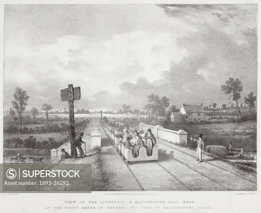 View showing the railway at the point where it crosses the canal built to link the Duke of Bridgwaters coal mines at Worsley with Manchester. The Liv...